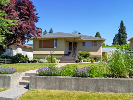 A perfect neighborhood. Neat residential house on the land terrace with concrete stairway and pathway to the entrance