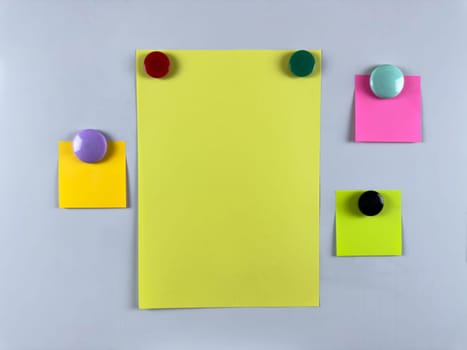 Array of notes attached to whiteboard with magnets suitable for managing tasks and reminders enhancing productivity and organization in office or classroom settings