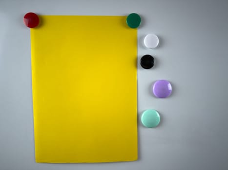 Note attached to whiteboard using variety of magnets, enhances organizational and planning efforts in both educational and corporate settings ideal for boosting productivity