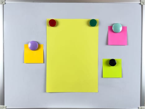Whiteboard featuring multiple notes with magnets perfect for organizing tasks reminders and schedules in office environment, enhancing productivity and efficiency, improving overall organization