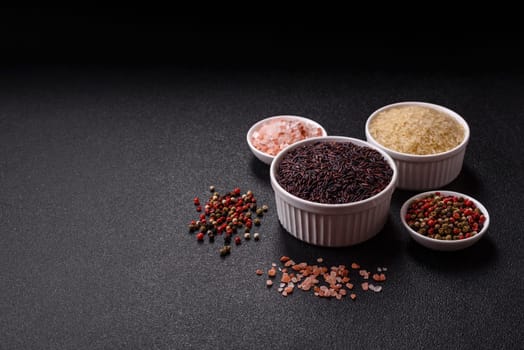 Red or brown raw rice in a ceramic bowl. Rice as an ingredient in Asian organic food