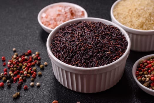 Red or brown raw rice in a ceramic bowl. Rice as an ingredient in Asian organic food