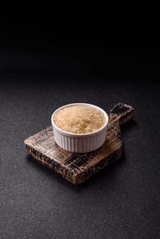 White raw rice in a ceramic bowl. Rice as an ingredient in Asian organic food