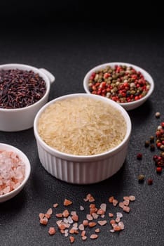 White raw rice in a ceramic bowl. Rice as an ingredient in Asian organic food