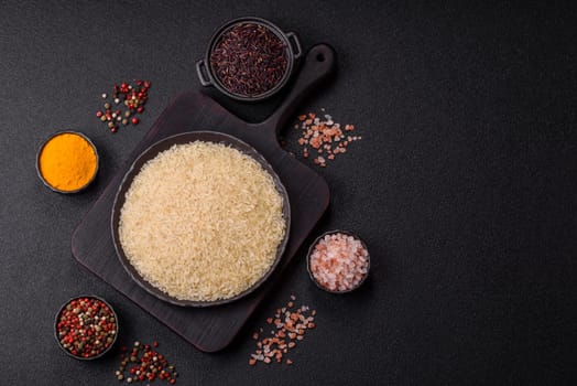 White raw rice in a ceramic bowl. Rice as an ingredient in Asian organic food