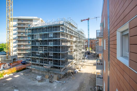 Construction site. Construction of Multi Storey Residential Building. Housing built. Tower Cranes on Residential buildings Construction.