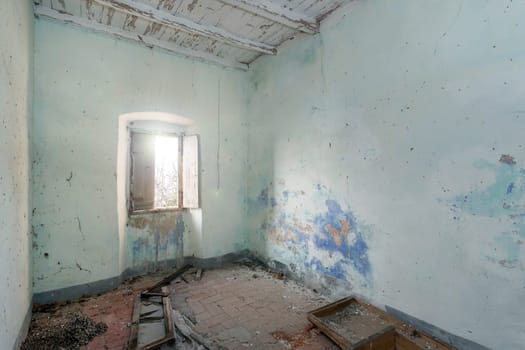 Damaged, dirty room of old abandoned building. To renovate.