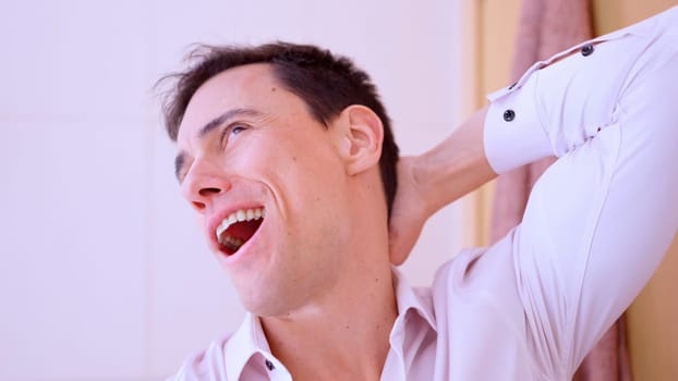 Funny and prankster man making funny face in bathroom