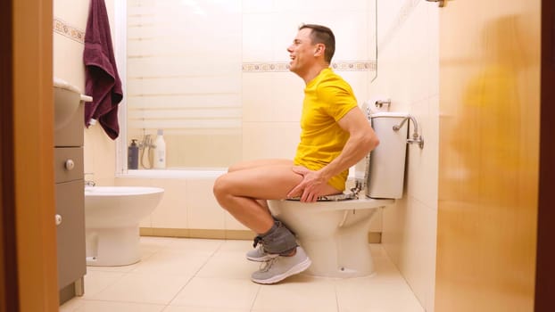 Happy man finds relief after using the toilet