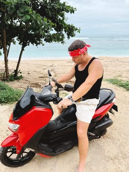 Man driving motorcycle on road.