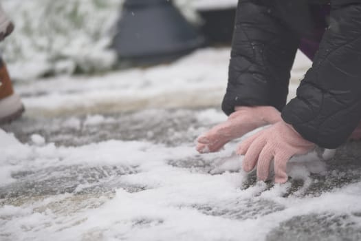 Kids enjoy the winter weather by creating patterns in the snow.