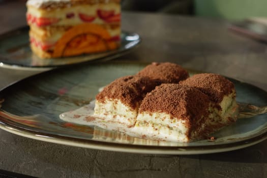 Delicious layered turkish baklava served on a plate in a cozy setting.