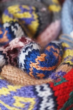 Vibrant yarn blends showcase unique knitted textures and colors.