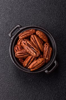 Nut, pecans in a ceramic bowl, an ingredient in vegan food. Nuts as a source of nutrients