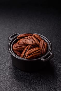 Nut, pecans in a ceramic bowl, an ingredient in vegan food. Nuts as a source of nutrients