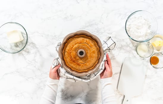 The freshly baked Carrot Bundt Cake is left to cool on the kitchen counter, filling the air with delightful aromas.