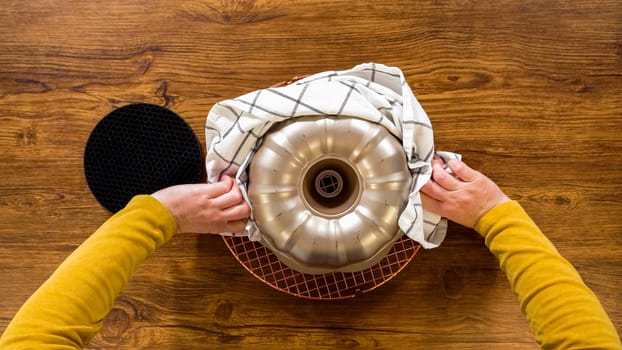 Flat lay. The gingerbread bundt cake gently eases out of its mold onto a wire rack, poised for a drizzle of sweet caramel frosting.