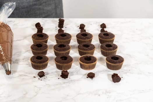 Each chocolate cupcake receives a generous filling of luscious caramel, adding an extra layer of flavor and indulgence.