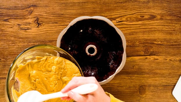Flat lay. Pouring the gingerbread cake batter into the greased bundt cake pan, ready for a delightful caramel frosting.