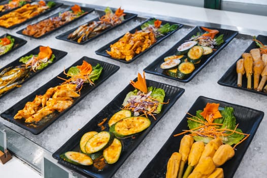Asian buffet in a hotel in Asia. Vietnamese food and dishes at the self-service restaurant for breakfast in Vietnam