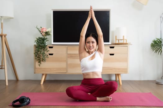 A dedicated yoga practitioner stretches in a serene environment, focusing on flexibility, tranquility, and mindfulness.