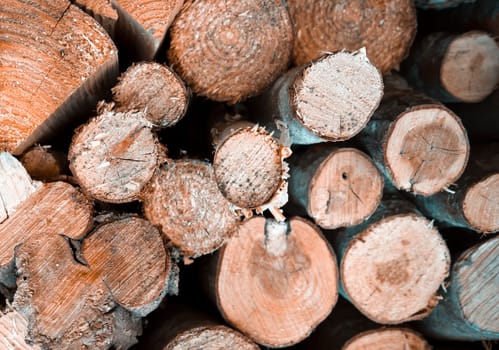 Logs for heating for the winter, background with firewood