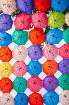 beautiful multicolored bright colorful umbrellas decoration on festive street on Magic City Park in Tashkent in Uzbekistan