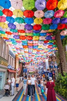 Hanging multicolored bright colorful umbrellas decoration Magic City Park in Tashkent. Tashkent, Uzbekistan - June 15, 2024