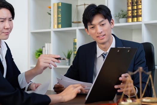 A lawyer presents case information to clients, emphasizing teamwork and collaboration in a client-focused legal consultation.