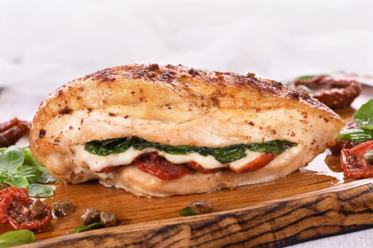 Baked chicken breast with spinach, sun-dried tomatoes and mozzarella
