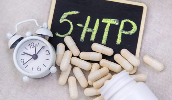 5-HTP sleep supplement capsules. Selective Focus. night.