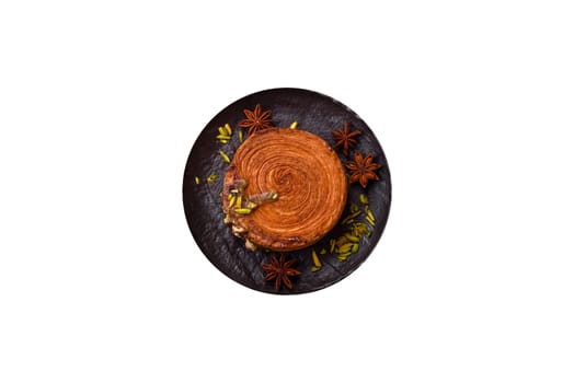 Round puff pastry croissant with pistachio filling or new york roll on white background