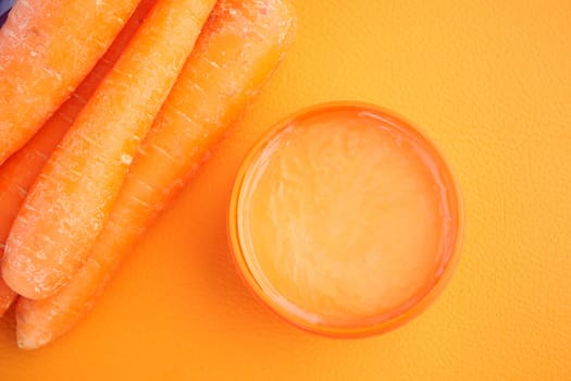 carrot flavour face cream in a container ,