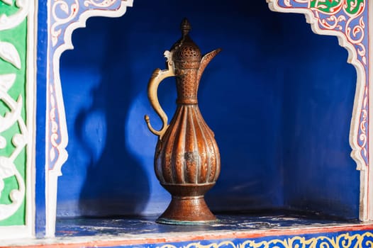 antique traditional Uzbek brass jug on exhibition at the Museum of Antiques in Tashkent in Uzbekistan