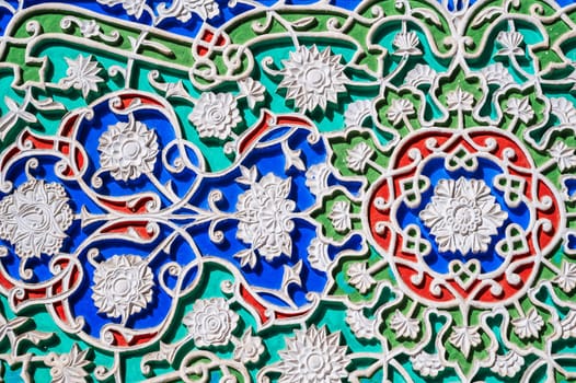 carved wooden painted background in Museum of Art of Uzbekistan with traditional Uzbek ornaments and colorful oriental patterns in Tashkent