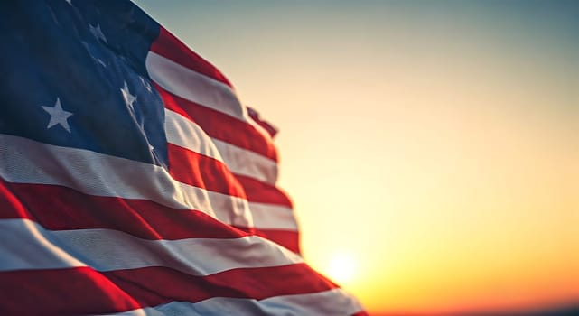 USA flag waving on orange sunset background. Ideal picture for banners.Wallpaper. Space for text.Independence Day and Memorial Day concept. Design for banner, header, greeting card.