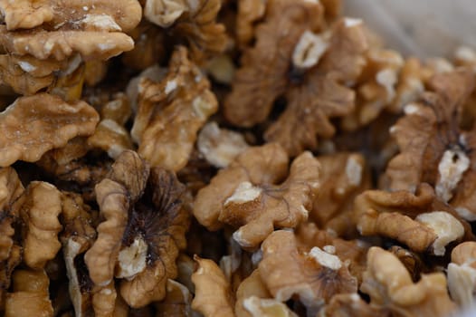 Piled high, walnut halves reveal their intricate shapes and warm, nutty hues, inviting culinary creativity and healthy snacking. Perfect for salads or baking, they tempt the senses.