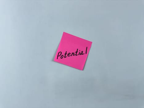 Sticky note with Potential written on it, set on a white background. This image symbolizes growth, opportunity, and capability, suitable for illustrating concepts of potential and future success