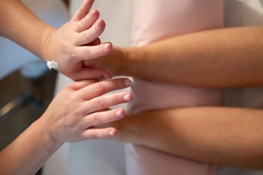 A professional massage therapist in a white uniform provides a soothing foot massage to a client in a calm and serene spa environment.