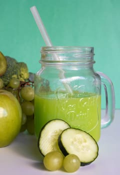 Modern jar with green smoothie.Healthy vegetarian food ingredients.Healthy food concept. Variety of organic fruits and vegetables. Vegan menu. Vertical real picture