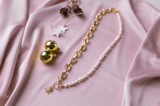 Women's Jewelry. Trendy jewelry on silk background. Flat lay, top view