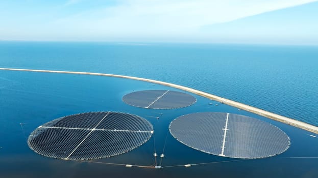 Round solar panels float on the water in the storage basins at Andijk in the Netherlands.
