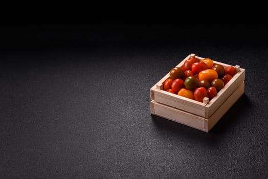 Tomatoes of different colors as a vegetable meal. Multicolored background consisting of cherry tomatoes