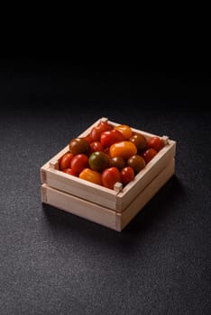 Tomatoes of different colors as a vegetable meal. Multicolored background consisting of cherry tomatoes