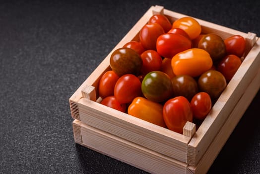 Tomatoes of different colors as a vegetable meal. Multicolored background consisting of cherry tomatoes