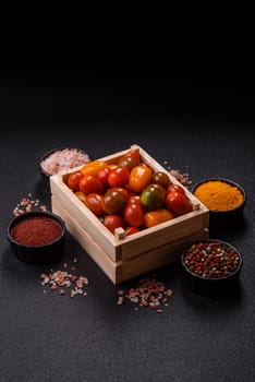 Tomatoes of different colors as a vegetable meal. Multicolored background consisting of cherry tomatoes