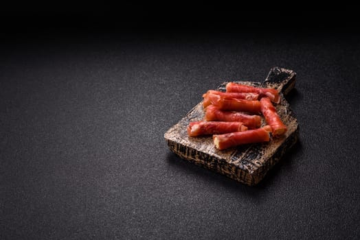 Cheese and meat, jamon or prosciutto rolled into a roll. Antipasti or delicacies for the festive table
