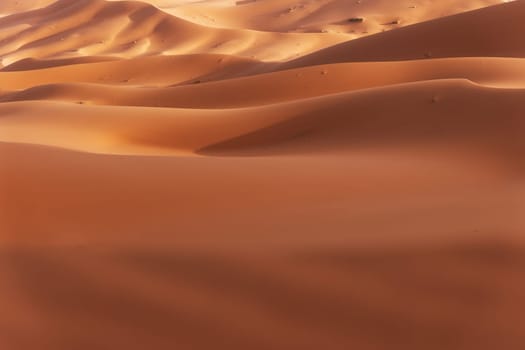 Golden sand dunes landscape background. West Sahara. Morocco.