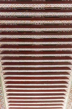 Closeup view of the handcrafted wooden detail at the Bahia Palace at Marrakesh. Morocco. Vertically. 