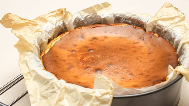 Stunning Top View of a Delicious Homemade Baked Cheesecake with Cracks on White Background.